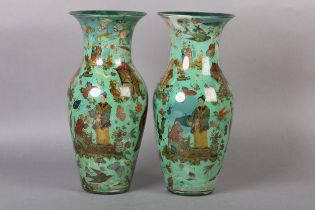 A PAIR OF 19TH CENTURY GLASS VASES with reverse decoupage of Chinese figures, houses, insects and