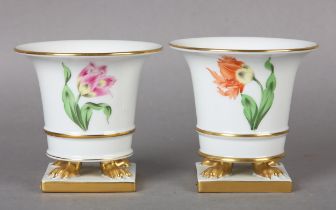 TWO HEREND PORCELAIN EMPIRE VASES, hand painted with a tulip, on claw feet and square plinth base,