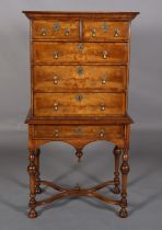 A QUEEN ANNE STYLE WALNUT AND CROSSBANDED CHEST ON STAND BY W AND D SEMPLE, having a moulded cornice