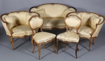 A LATE 19TH CENTURY WALNUT SALON SUITE, each piece having an encircling frame moulded and carved