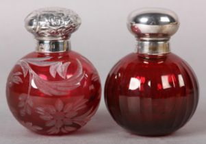 TWO SILVER MOUNTED RUBY GLASS BOTTLES, cylindrical and globular, etched with flowers and foliage,