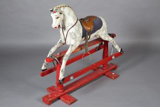 A MID 20TH CENTURY ROCKING HORSE, black and white dappled body with