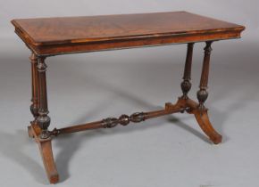 A VICTORIAN FIGURED WALNUT AND CROSSBANDED TABLE inlaid with ebony stringing, the twin tapered and