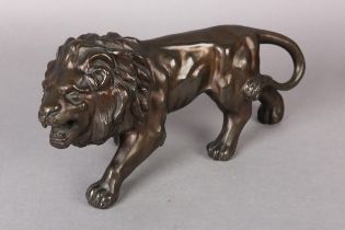 A JAPANESE BRONZE, model of a snarling lion with tail tucked in and teeth bared, Meiji period,