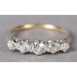 A FIVE STONE DIAMOND RING, c1940 in 18ct yellow and white gold, the graduated Old European and