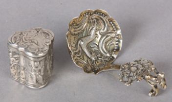 A CONTINENTAL SILVER CADDY SPOON, embossed to the bowl with a stag within a surround of 'C' scrolls,