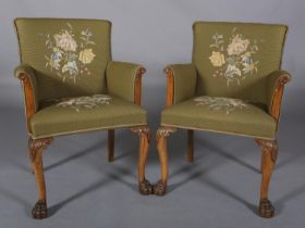 A PAIR OF LEES TAPESTRY WALNUT ARMCHAIRS upholstered to the back, arms and seats, leaf carved arm
