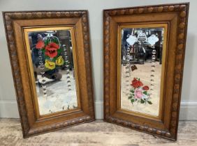 A pair of Edwardian oak framed mirrors etched and painted with flowers