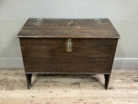 An 18th century boarded chest having a slightly sloped top, with later brass hinges and