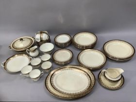 A Bishop china dinner and tea service with black and gilt border comprising 10 saucers, nine cups (