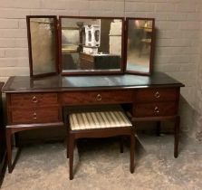 A Stag Minstrel dressing table with triple mirrors and stool together with a three height chest of