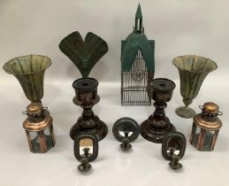 A pair of bronzed fluted vases on circular bases, palm frond candle stand, a model bird cage, a pair