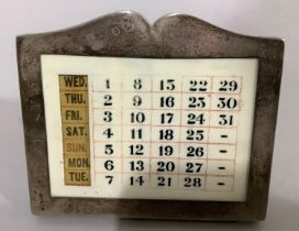 A George V silver and ivorine desk calendar Birmingham 1925 for Adie Brothers Ltd, the fixed date in
