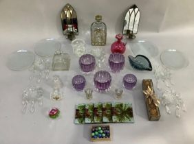 A gilded glass liqueur decanter and two glasses, a set of five amethyst glass tealight holders,