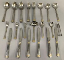 A suite of stainless steel cutlery with gilt detail for twelve settings comprising eleven dinner