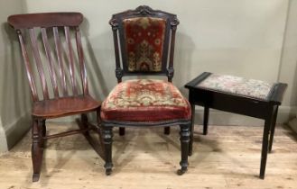 A late Victorian/Edwardian rail back rocking chair on turned supports together with a Victorian