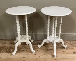 A pair of circular bedside tables on four barley twist column uprights, under tier and four scroll