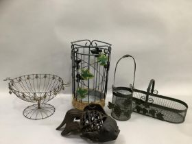 A cast iron pierced fish shaped tea light holder, various wire baskets and plant holders