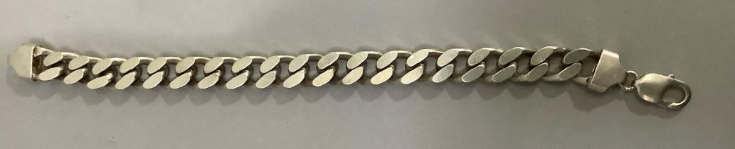 A bracelet in silver facetted curb links, approximate weight 66g