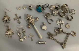 A collection of silver jewellery including rings, pendants, bracelet and an early 20th century