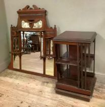 An Edwardian mahogany revolving bookcase together with an over mantel mirror with shelves