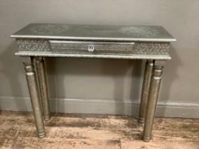 A gilt metal console table, moulded with Middle Eastern style moulding, 90cm wide