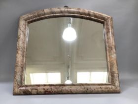 A marble framed wall mirror of curved profile and cushion frame, 88cm x 80cm