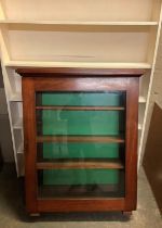 A 19th century mahogany and glazed single door bookcase (part of a larger piece) together with a set