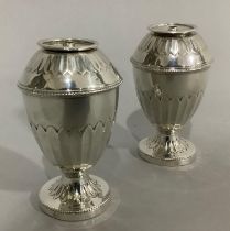 A pair of George III silver pepper pots, London 1809 for George Gray later converted to table