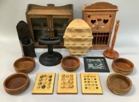 A set of six turned wooden salad bowls, an oak and glazed two door wall cabinet, egg rack, plate