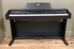 A Celviano electric mini piano by Casio in ebonised case