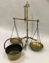 A set of brass scales by Doyle & Son Borough London and a brass jam pan
