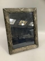 An Elizabeth II silver fronted photograph frame, Sheffield 2000 with Millennium mark for Carrs,