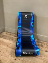 An X-rocker freestanding foam filled chair together with a near pair of swivel desk chairs on chrome