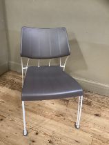 An Ikea white metal framed garden chair