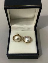 A pair of Mabé pearl ear studs in 9ct gold, approximate diameter 13.5mm, approximate weight 4g