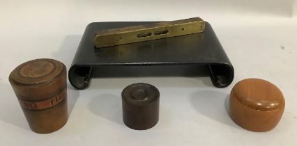 Two turned treen containers, a spirit level, a Chinese carved ebonised stand, another turned