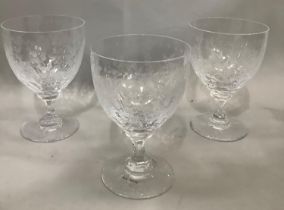 A set of three wine goblets by William Yeoward, the bodies etched with fronds with dented stems,