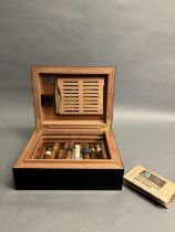 A HUMIDOR BY GERMANUS FOR APPROXIMATELY 50 CIGARS, black ebonised finish, fitted internal