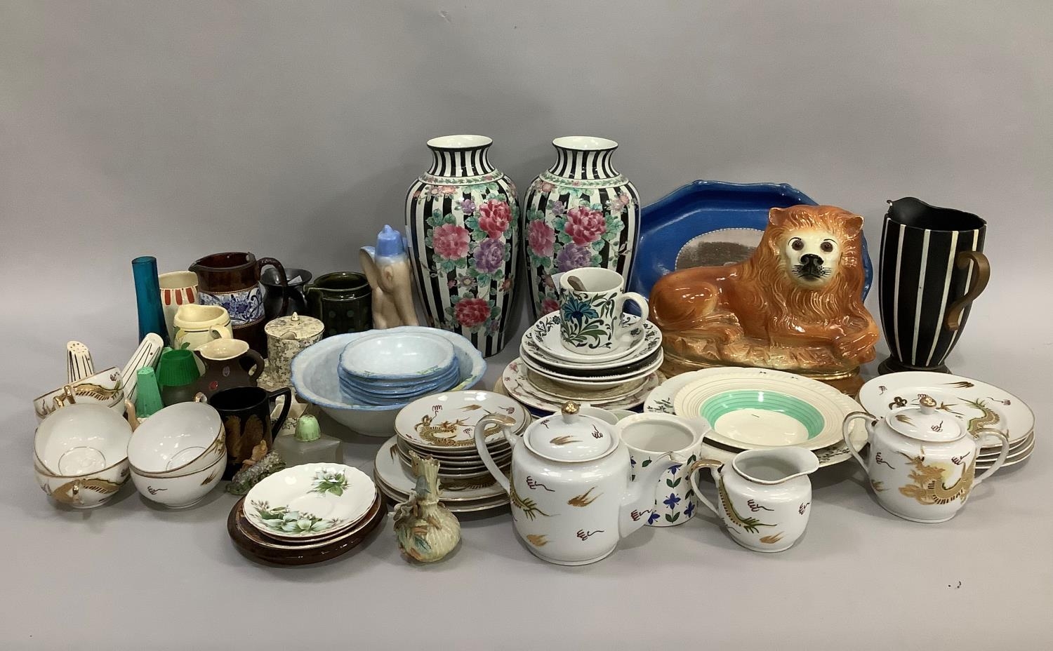 A quantity of ceramics to include, two black and white striped floral vases, a Staffordshire style