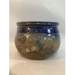 A French faience pot having the globular body having a blue and brown glaze, having incised floral