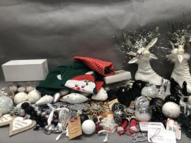 A quantity of Christmas tree decorations including glittery snowflakes, hymn books and others, in