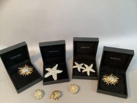 A small collection of earrings and brooches all by Swarovski, several in original boxes
