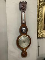 An early 19th century mahogany banjo barometer with boxwood stringing, silvered dial, convex