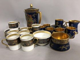 A Carlton blue, and gilt coffee service comprising six coffee cans and saucers, milk jug, sugar bowl