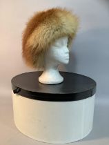 A Frederick Fox c. 1975 red fox fur hat, with hat box