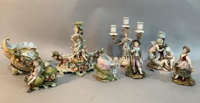 A continental porcelain three light candelabra modelled with a figure, a candlestick modelled with