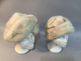 A Phillip Somerville cream rovalia mink hat 1970's together with a Frederick Fox brown fur hat, both