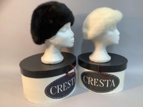 Two Phillip Somerville winter hats, in black-glama mink c.1977 and a white mink c.1979, both in