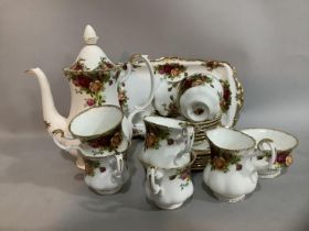 A Royal Albert Old Country Roses pattern coffee service comprising coffee pot, six cups and saucers,